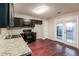 Well-lit kitchen with stainless steel appliances, and dark cabinets at 937 Ohara Drive Dr, Jonesboro, GA 30236