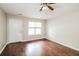 Bright living room boasts hardwood floors, a ceiling fan, and a window for natural light at 937 Ohara Drive Dr, Jonesboro, GA 30236