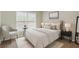 Well-lit bedroom with large window and a comfortable upholstered bed with side tables at 1574 Glenfield Dr, Lawrenceville, GA 30043