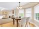 Bright dining area with views to the fireplace in the living room at 1574 Glenfield Dr, Lawrenceville, GA 30043