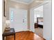 Inviting foyer with hardwood floors and a view to the staged bedroom at 1574 Glenfield Dr, Lawrenceville, GA 30043