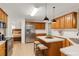 Well-equipped kitchen with island and stainless steel appliances, great for cooking at 1574 Glenfield Dr, Lawrenceville, GA 30043