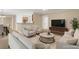 Spacious living room with ample seating, a TV, and decor at 1574 Glenfield Dr, Lawrenceville, GA 30043