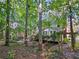 Backyard landscaping with a hammock. Enjoy nature in the backyard at 1620 Silverleaf Way, Alpharetta, GA 30005