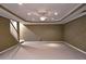 Unfinished basement with neutral walls, carpet, recessed lighting and ceiling fan at 1620 Silverleaf Way, Alpharetta, GA 30005