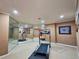 Spacious basement area featuring a treadmill and mirrored wall, perfect for a home gym at 1620 Silverleaf Way, Alpharetta, GA 30005