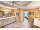 Bright primary bathroom with double vanity, tile flooring, and decorative lighting at 1620 Silverleaf Way, Alpharetta, GA 30005