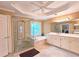 Bright bathroom featuring double vanity, garden tub, glass shower and decorative mirror at 1620 Silverleaf Way, Alpharetta, GA 30005