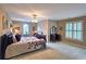 Spacious bedroom featuring carpet flooring, neutral walls, and window providing lots of natural light at 1620 Silverleaf Way, Alpharetta, GA 30005