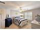 Bright bedroom with neutral walls, carpet, shuttered windows, nautical decor and a bed with striped bedding at 1620 Silverleaf Way, Alpharetta, GA 30005