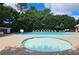 Resort-style pool area with sundeck, lounge chairs, umbrellas and lush landscaping. Outdoor resort community at 1620 Silverleaf Way, Alpharetta, GA 30005