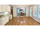 Bright dining area with hardwood floors, adjacent to a well-appointed kitchen at 1620 Silverleaf Way, Alpharetta, GA 30005