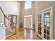 Grand foyer with hardwood floors, high ceilings and a large arched window at 1620 Silverleaf Way, Alpharetta, GA 30005