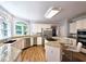 Charming kitchen featuring stainless steel appliances, granite counters and hardwood floors at 1620 Silverleaf Way, Alpharetta, GA 30005