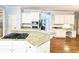 Gourmet kitchen offering granite countertops, cooktop island, and ample cabinet space at 1620 Silverleaf Way, Alpharetta, GA 30005