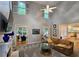 Comfortable living room featuring high ceilings, a fireplace, and seamless access to the sunroom at 1620 Silverleaf Way, Alpharetta, GA 30005