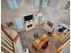 Living room with a fireplace, flat screen television and stairs leading to the second floor at 1620 Silverleaf Way, Alpharetta, GA 30005