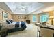 Bright main bedroom featuring large bed, seating area and windows providing tons of natural light at 1620 Silverleaf Way, Alpharetta, GA 30005