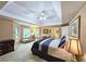 Spacious main bedroom featuring large bed, bedside tables, sitting area and large windows at 1620 Silverleaf Way, Alpharetta, GA 30005