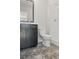 Bathroom featuring a black vanity with gray countertops and glass shower at 2718 Byess Ct, Marietta, GA 30064
