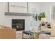 Cozy living room showcasing a fireplace, neutral color palette, and ample natural light at 2718 Byess Ct, Marietta, GA 30064