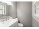 Bathroom featuring neutral colors, modern vanity, and window at 409 Colette Ln, Social Circle, GA 30025