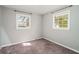 Bedroom with two windows allowing for ample natural light at 409 Colette Ln, Social Circle, GA 30025