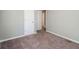 Neutral bedroom featuring carpet and doorway to bathroom at 409 Colette Ln, Social Circle, GA 30025