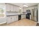Spacious kitchen with stainless steel appliances, granite countertops, and plenty of cabinet space at 409 Colette Ln, Social Circle, GA 30025