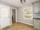 Mud room next to kitchen with tile flooring, access to the backyard, and utility closet nearby at 409 Colette Ln, Social Circle, GA 30025
