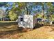 Outdoor shed in a lush green landscape with natural lighting at 409 Colette Ln, Social Circle, GA 30025