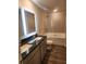 Bathroom with tiled shower, soaking tub, granite countertops, and modern light-up mirror at 4856 Station Road-Lot 21, Union City, GA 30349
