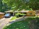 Charming home with a spacious front yard, screened-in porch, and brick exterior at 965 Stokeswood Se Ave, Atlanta, GA 30316