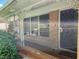 Welcoming front porch with ornate trim, secure metal door, and a well-kept lawn at 965 Stokeswood Se Ave, Atlanta, GA 30316