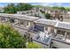 Aerial view showcases modern townhomes with rooftop patios, solar panels, and stylish outdoor seating at 1049 Brandsford Nw St # 27-01, Atlanta, GA 30318
