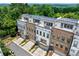 Charming townhome exteriors with brick and light siding, front-entry garages, and solar panels at 1049 Brandsford Nw St # 27-01, Atlanta, GA 30318