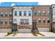 Charming townhome with well-maintained landscaping, showcasing its inviting facade and curb appeal at 1049 Brandsford Nw St # 27-01, Atlanta, GA 30318