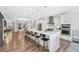 Spacious kitchen featuring a large island with seating and stainless steel appliances and open living space at 1049 Brandsford Nw St # 27-01, Atlanta, GA 30318