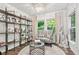 Bright office space with large windows, custom shelving, and comfortable seating at 1049 Brandsford Nw St # 27-01, Atlanta, GA 30318