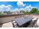 Spacious rooftop terrace with dining set and city views at 1049 Brandsford Nw St # 27-01, Atlanta, GA 30318