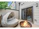 Relaxing outdoor patio with a daybed and fire pit, accessible through sliding glass doors at 1049 Brandsford Nw St # 27-01, Atlanta, GA 30318