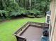 View from wood deck of lawn and trees at 2181 Rodao Sw Dr, Lilburn, GA 30047