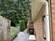 Home exterior featuring side entrance, stairs, and landscaped yard at 2181 Rodao Sw Dr, Lilburn, GA 30047