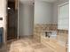 Bathroom with a shower, garden tub, and tile backsplash at 2181 Rodao Sw Dr, Lilburn, GA 30047