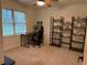 A bedroom with shelving, a desk, and lots of light from the window at 2181 Rodao Sw Dr, Lilburn, GA 30047