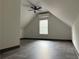Bright bonus room with vaulted ceiling, tile floors, and window at 2181 Rodao Sw Dr, Lilburn, GA 30047