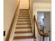 Classic staircase with wooden railings and steps, leading to the upper level of the home at 2181 Rodao Sw Dr, Lilburn, GA 30047