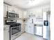 Charming kitchen featuring stainless steel appliances and ample white cabinets at 2965 Pharr Court South Nw # 817, Atlanta, GA 30305