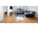 Spacious living room featuring hardwood floors and a large window with natural light at 2965 Pharr Court South Nw # 817, Atlanta, GA 30305