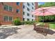 Community patio with seating and an umbrella, perfect for outdoor relaxation and socializing at 2965 Pharr Court South Nw # 817, Atlanta, GA 30305